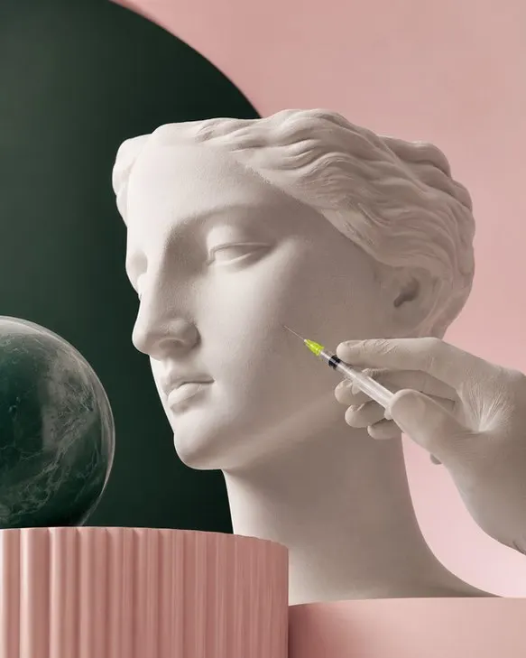 A classical bust with a precision instrument, shot in the studio palette