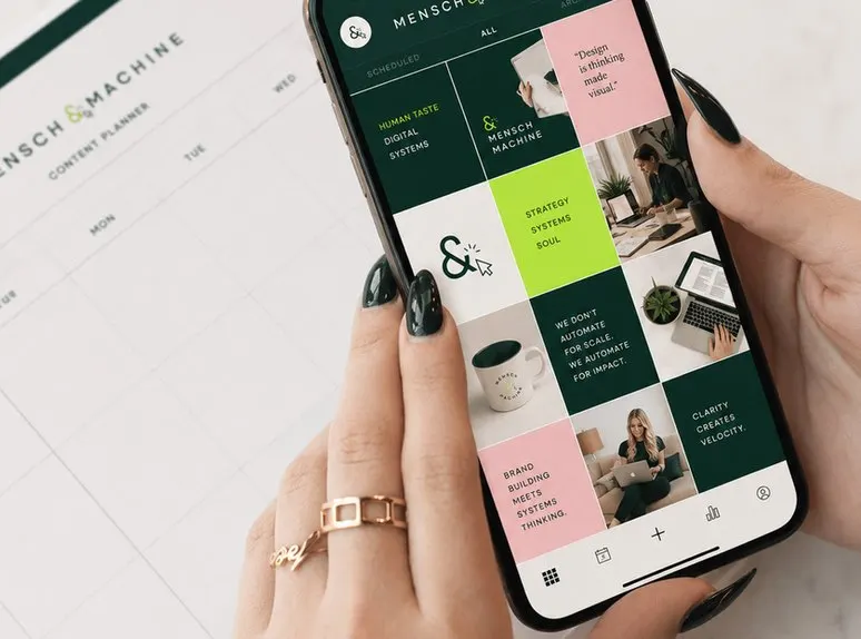 Hand holding a smartphone displaying a social feed